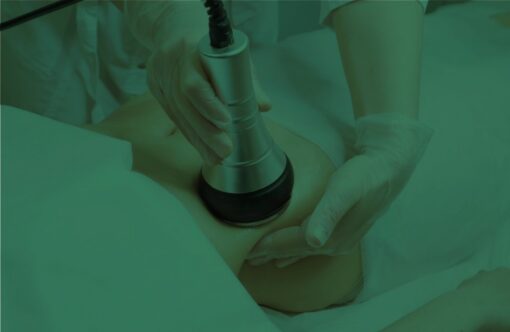 Ultrasound fat reduction treatment being performed on a patient for body slimming and contouring purpose.