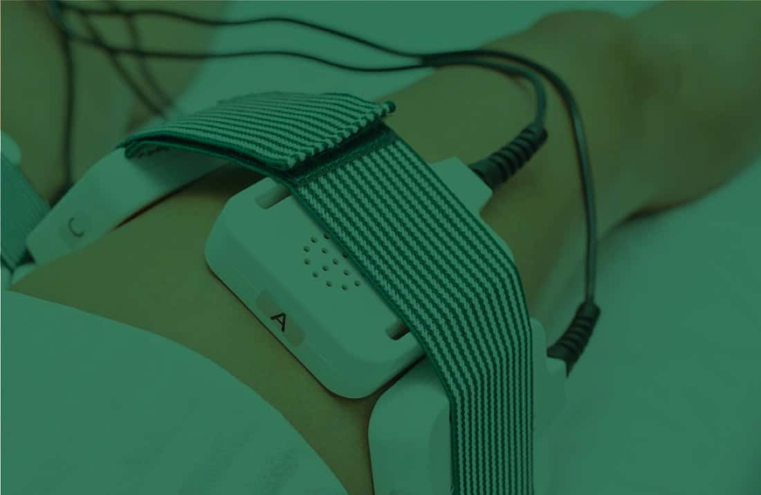 Flexible EMS body slimming device with adjustable straps for non-invasive fat reduction treatments.