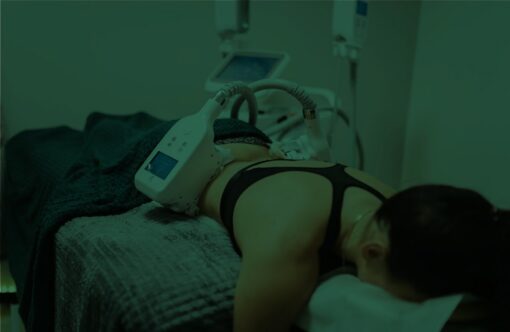 Non-invasive fat reduction treatment being performed on a woman lying on a treatment bed at SLIMM clinic, using advanced body contouring technology for safe weight loss and body shaping, SEO optimized image.